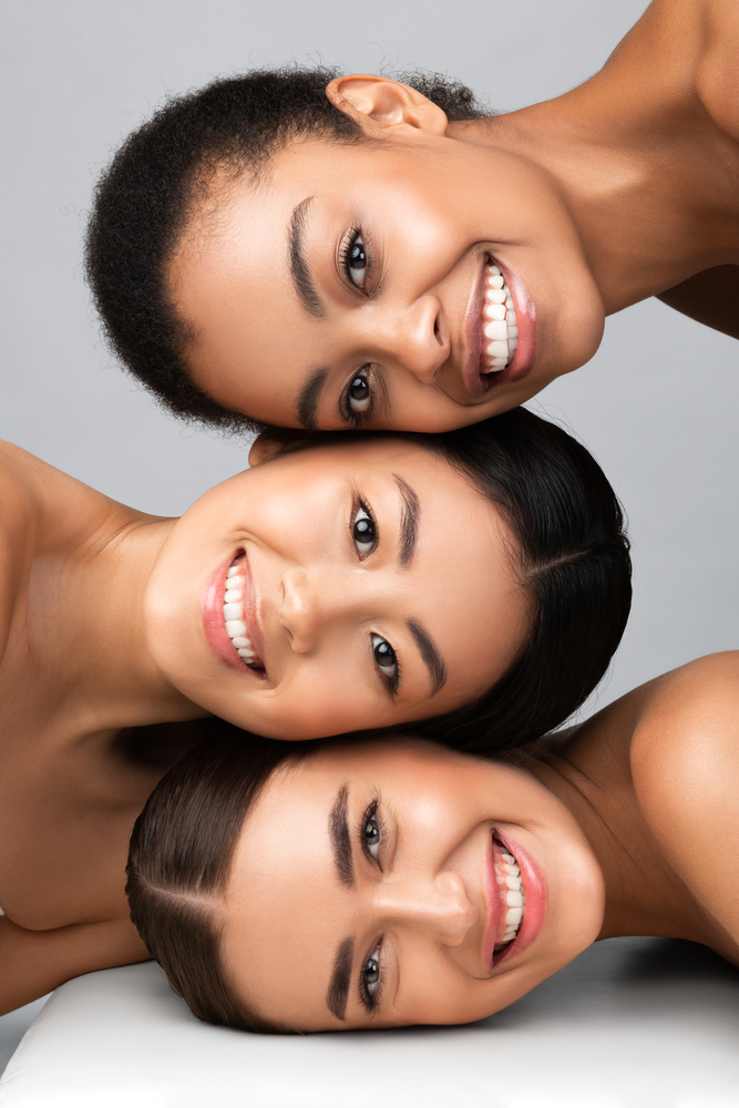Three,Diverse,Women,With,Perfect,Faces,And,Skin,Posing,Together